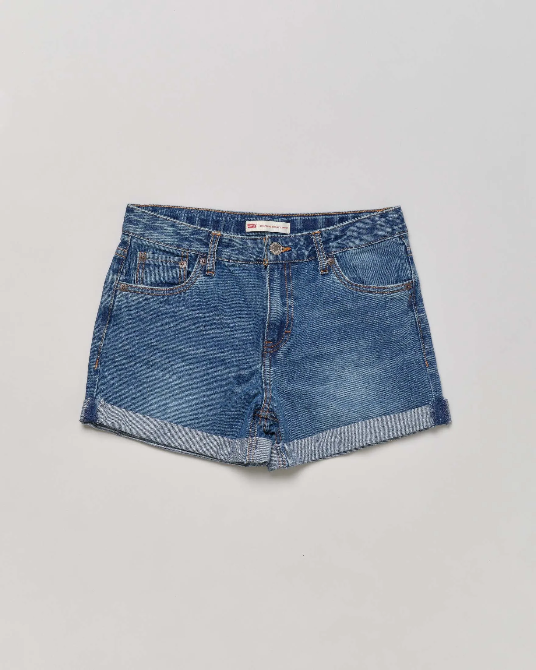 Shorts in denim lavaggio medio stone washed con risvolto sul fondo 10-16 anni